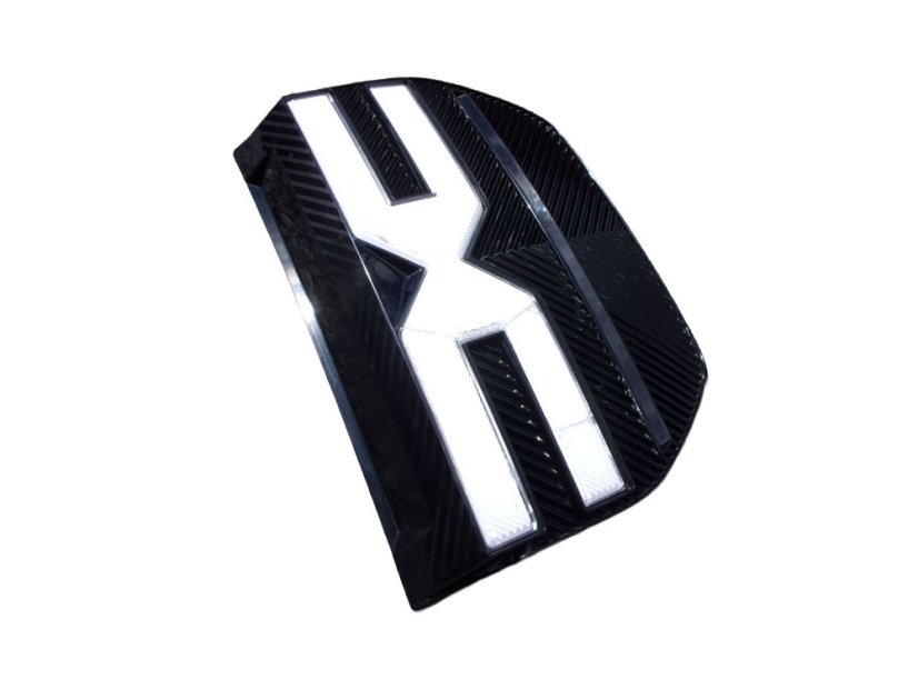 622568058R-3 Front bumper logo Dacia Spring, cracks on white part